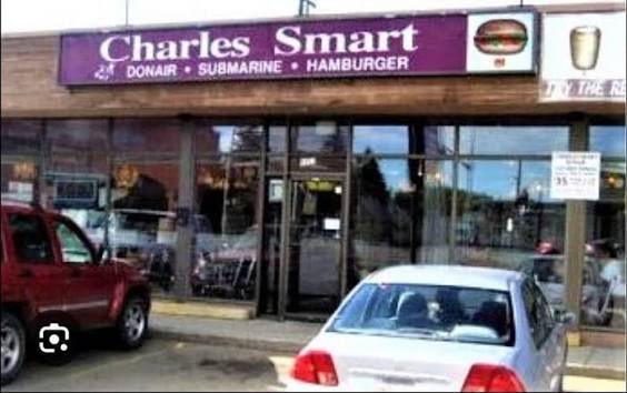 Supplied Charles Smart storefront photo showing the purple sign